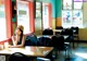 A woman sitting at a table in a restaurant.